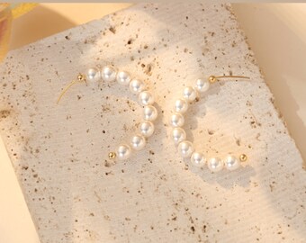 Half moon style pearl hoop earring