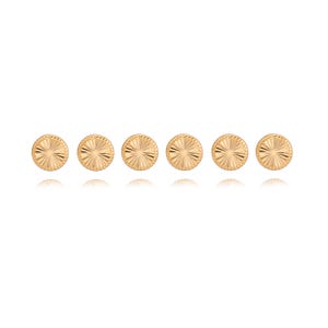 May include: Six gold-colored stud earrings arranged in a row. Each earring is round with a sunburst design radiating from the center. The earrings are displayed against a white background.