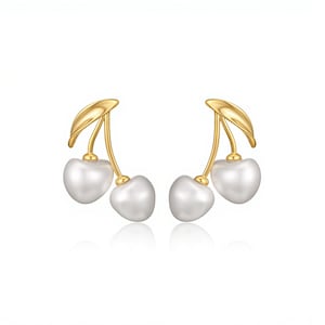 May include: A pair of gold-colored cherry earrings with white pearl-like fruit. The earrings have a stem and leaf design, with the cherries hanging below. The earrings are displayed on a white background.