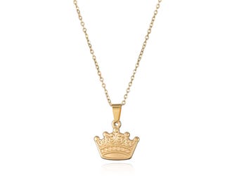 May include: A gold-tone necklace with a small crown pendant.