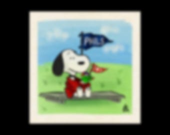 May include: A cartoon illustration of Snoopy, wearing a red outfit, holding a green object and a red flag. Snoopy is standing on a wooden surface with a blue and white flag that says "PHILS". The background is a green field and blue sky.