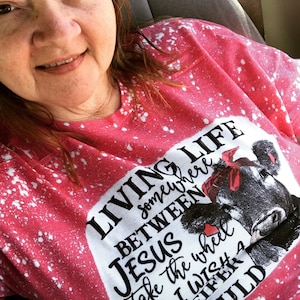 Living life somewhere between Jesus take the wheel and I wish a heifer would T-shirt