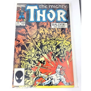May include: A vintage comic book titled "The Mighty Thor" featuring a vibrant cover illustration. The cover art depicts a battle scene with numerous figures and the text "BALDER--THE BRAVE?" The comic is marked with the Marvel logo and issue number 344.