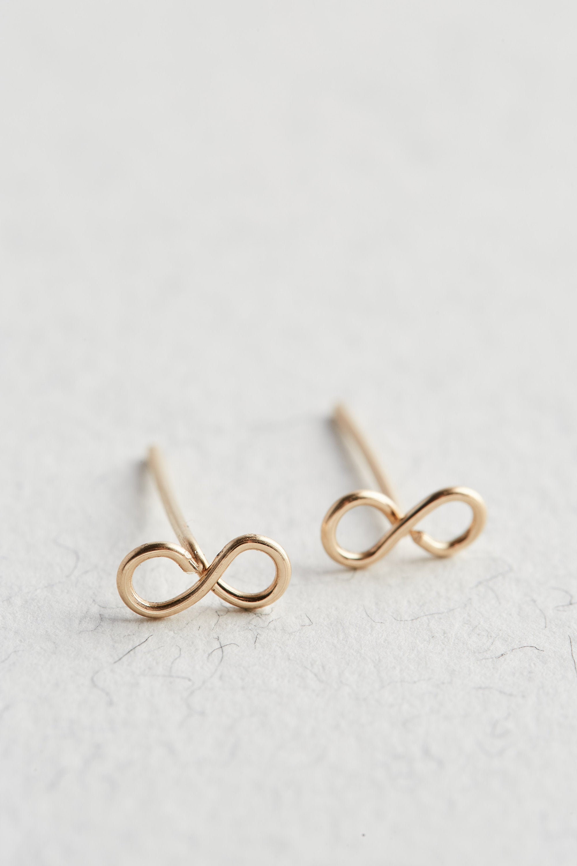 Amazon.com: Tooliks - Infinity Stud Earrings - Tiny Gold Post Earrings (gold  coated) : Handmade Products