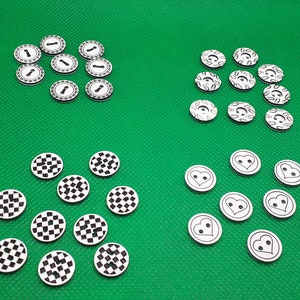 May include: Assortment of black and white buttons with various designs. Some buttons feature a chequered pattern, while others have a heart or a keyhole design.