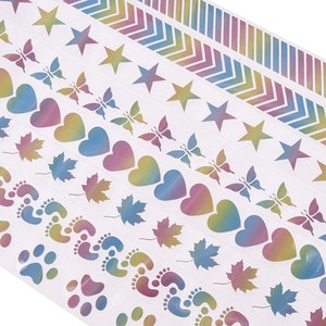 May include: A sheet of colorful holographic stickers with various designs, including stars, butterflies, hearts, maple leaves, footprints, and paw prints.