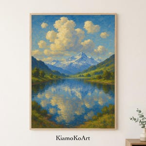 Puede incluir: Pintura de paisaje enmarcada que representa una escena de lago de montaña. La obra presenta un cielo azul con nubes blancas y esponjosas, montañas nevadas y verdes colinas reflejadas en el agua. El nombre del artista, KiamoKoArt, es visible en la parte inferior.
