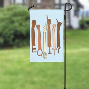 May include: A blue garden flag with a design of multiple hands in different skin tones forming the word "EQUITY".