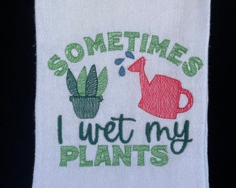 Embroidered “Sometimes I Wet My Plants” kitchen towel in white cotton