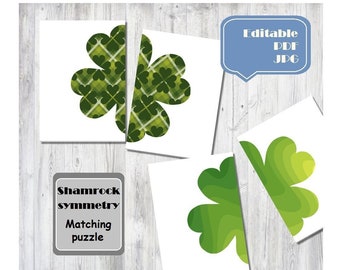 May include: A set of four cards featuring shamrock designs in various shades of green. The cards are arranged on a light wood-grain surface. Text on the image reads "Shamrock symmetry Matching puzzle" and "Editable PDF JPG".