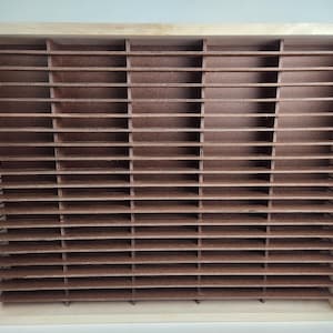 May include: A wooden storage box with a brown cardboard insert. The insert has multiple compartments for organizing small items.