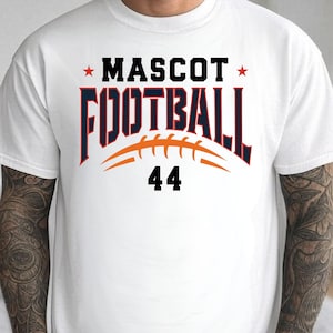 May include: White t-shirt featuring the text "MASCOT FOOTBALL" in black and navy blue, with an orange football graphic and the number 44. The shirt has a crew neck design.
