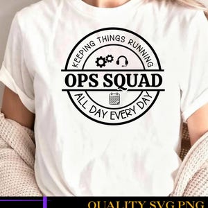 May include: A white short-sleeved t-shirt featuring a black circular graphic on the chest. The design includes the text "KEEPING THINGS RUNNING", "OPS SQUAD", and "ALL DAY EVERY DAY", along with icons of gears, a headset, and a calendar.