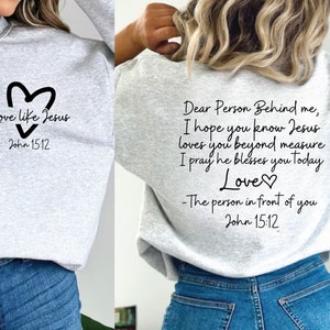 May include: Gray sweatshirt with a heart and the text "Love like Jesus" and "John 15:12" on the front. The back of the sweatshirt has the text "Dear Person Behind me, I hope you know Jesus loves you beyond measure I pray he blesses you today Love - The person in front of you John 15:12"