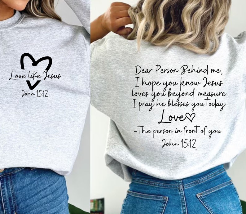 May include: Gray sweatshirt with a heart and the text "Love like Jesus" and "John 15:12" on the front. The back of the sweatshirt has the text "Dear Person Behind me, I hope you know Jesus loves you beyond measure I pray he blesses you today Love - The person in front of you John 15:12"