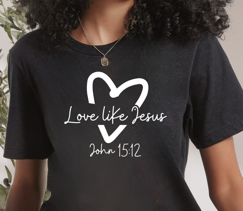 May include: Black t-shirt with a white heart and the text "Love like Jesus John 15:12"
