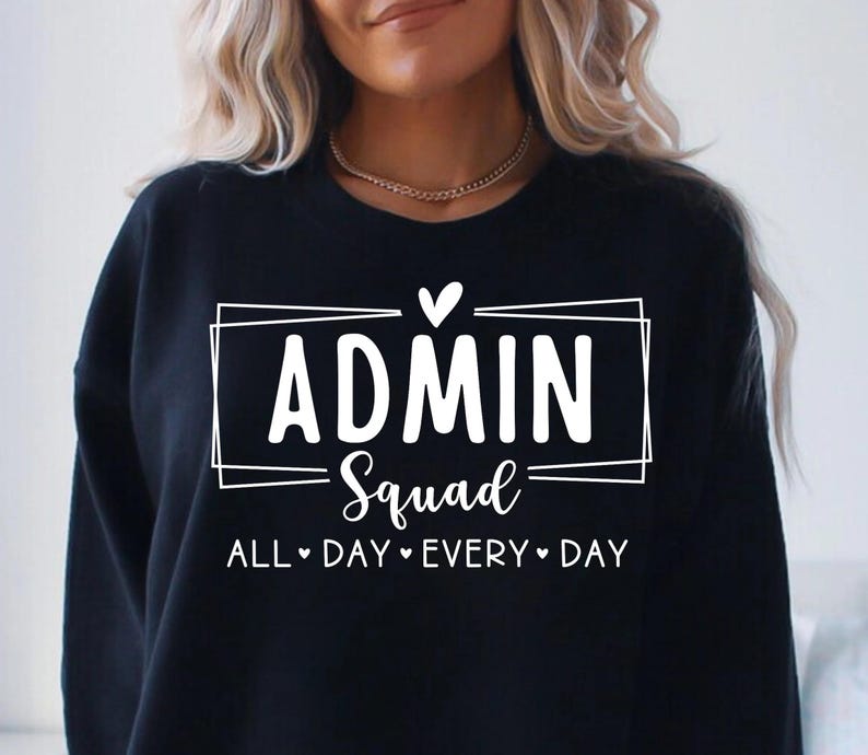 May include: Black sweatshirt with the text "ADMIN Squad" inside a white rectangular frame, with the words "ALL DAY EVERY DAY" below. A small white heart is above the word "ADMIN".