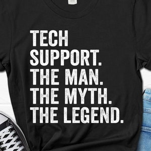 May include: Black t-shirt with white text that reads "Tech Support. The Man. The Myth. The Legend."