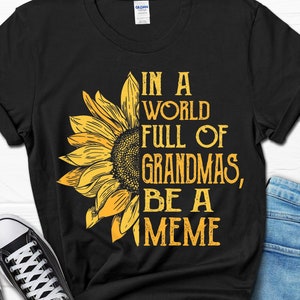 In a World Full of Grandmas be a Meme Shirt, Meme Gift, Gifts for Meme, Meme Mother’s Day Gift, New Grandma Sunflower Tee