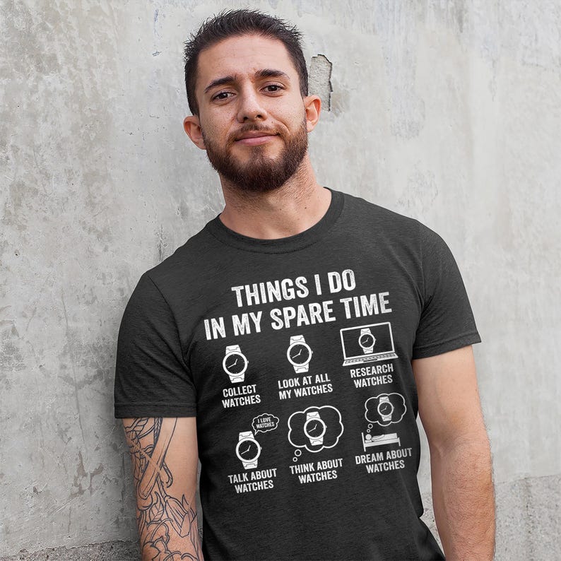 May include: A black t-shirt with the text "THINGS I DO IN MY SPARE TIME" and watch-related graphics. The shirt lists activities like collecting, looking at, and researching watches. The text is in white.