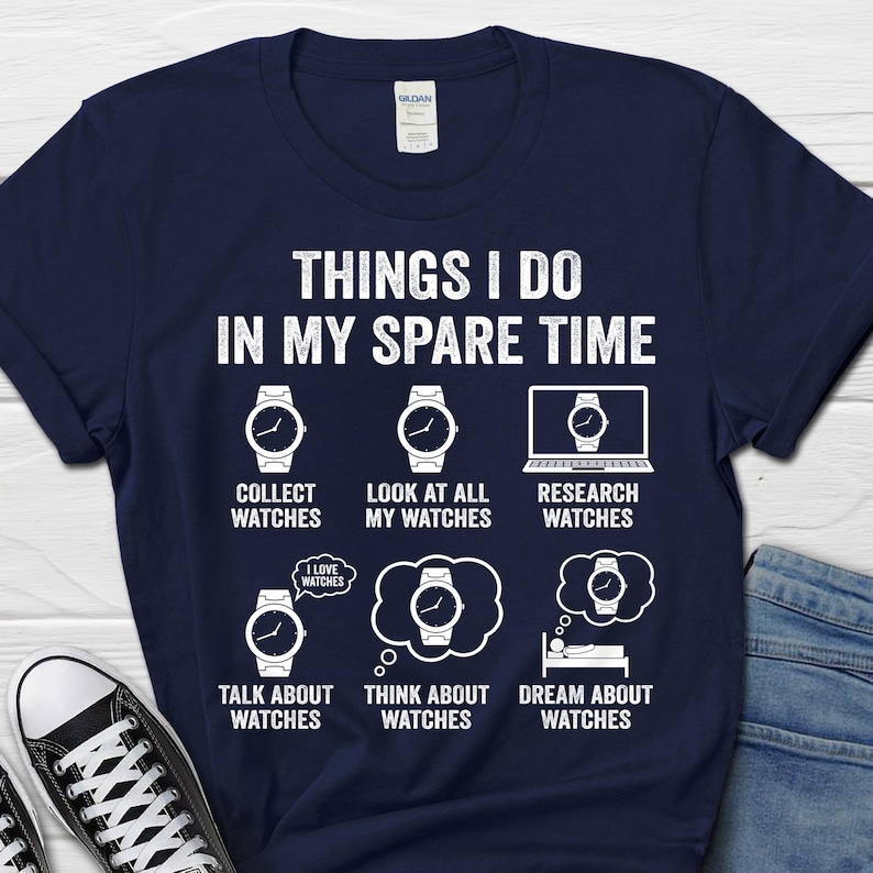 May include: Navy blue t-shirt with the text "THINGS I DO IN MY SPARE TIME" and watch-themed graphics. The graphics include watches and phrases like "Collect Watches" and "Dream About Watches".