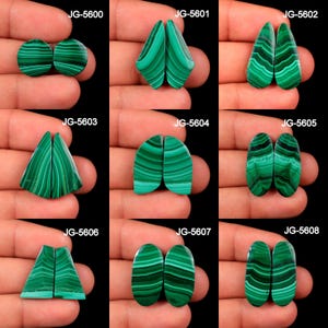 May include: A collection of malachite gemstone pairs in various shapes, including round, teardrop, and oval. Each pair displays a vibrant green color with distinctive banded patterns. The gemstones are presented against a dark background, highlighting their natural beauty.