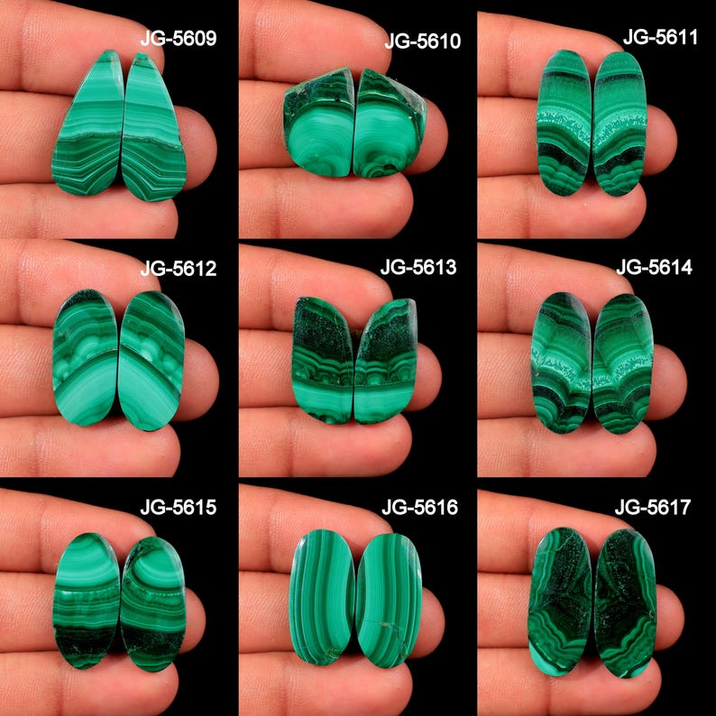 May include: A collection of nine pairs of polished malachite gemstones, each displaying unique patterns of green and black bands. The gemstones vary in shape, including teardrop, oval, and irregular forms. Each pair is labeled with a unique code.