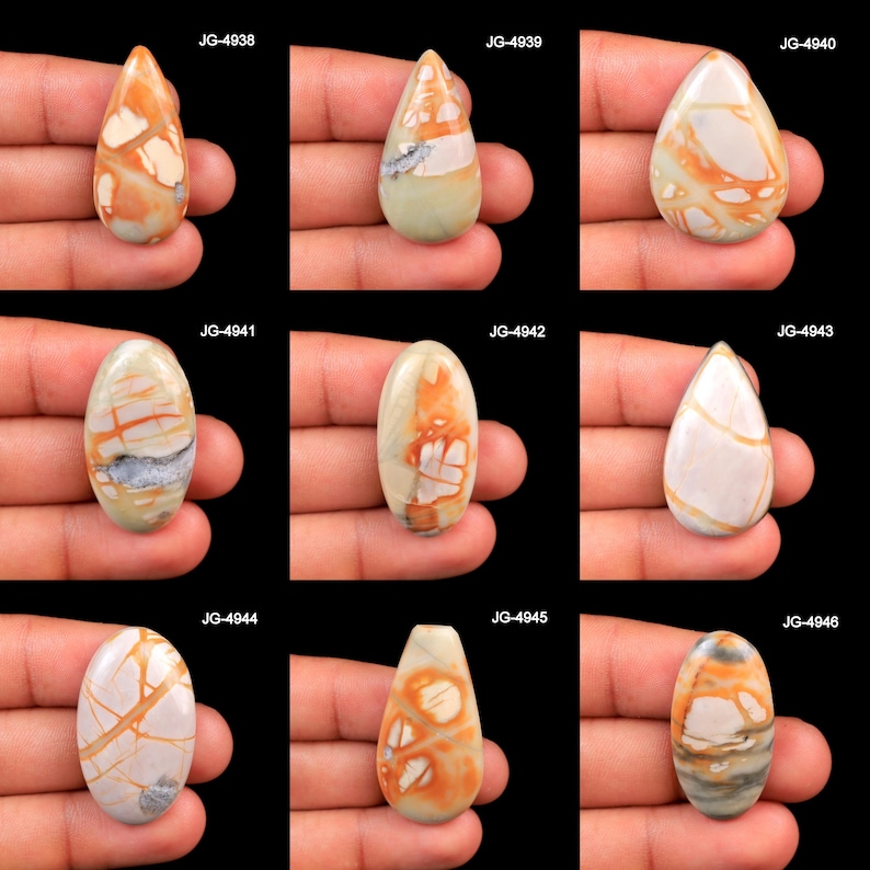 May include: A collection of nine polished, teardrop and oval-shaped cabochons featuring intricate patterns of orange, cream, and grey veining. Each stone is labeled with codes JG-4938 through JG-4946, showcasing unique natural mineral formations.
