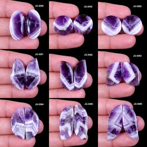 May include: A collection of polished amethyst gemstone pairs, showcasing diverse shapes such as ovals and circles. The gemstones feature striking purple and white striped patterns. Each pair is presented against a dark backdrop.