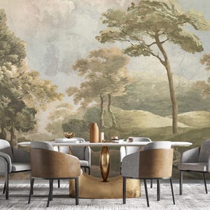 May include: A dining set featuring an oval table with a gold pedestal base and six chairs with grey fabric seats and tan leather-like backs. The wall behind the furniture displays a large-scale mural of a landscape with trees in muted green tones.
