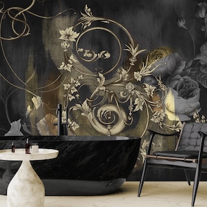 May include: A stylish bathroom interior with a black marble bathtub, a small white side table, and a black chair. The wall features a dark, ornate floral mural in gold and grey tones, creating a luxurious and sophisticated atmosphere.