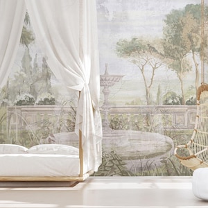 May include: A bedroom scene featuring a four-poster bed with white linens and sheer curtains. A hanging wicker chair and a white ottoman are also present. The backdrop is a mural depicting a classical garden scene.