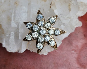 Antique 7 point star rhinestone brooch