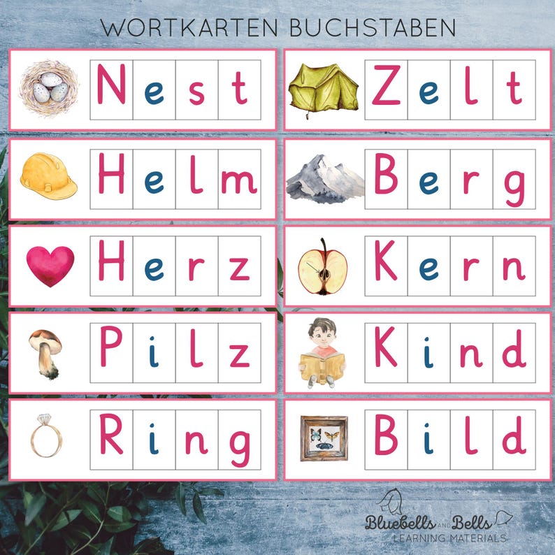 May include: A set of 10 colourful flashcards with illustrations and German words. The words are: Nest, Zelt, Helm, Berg, Herz, Kern, Pilz, Kind, Ring, Bild.