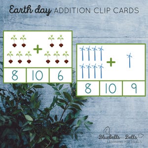 May include: Two addition clip cards with an Earth Day theme. The first card shows a picture of 8 green plants with brown roots and 6 green plants with brown roots. The second card shows a picture of 8 blue windmills and 1 blue windmill. The text "Earth day ADDITION CLIP CARDS" is at the top of the image.