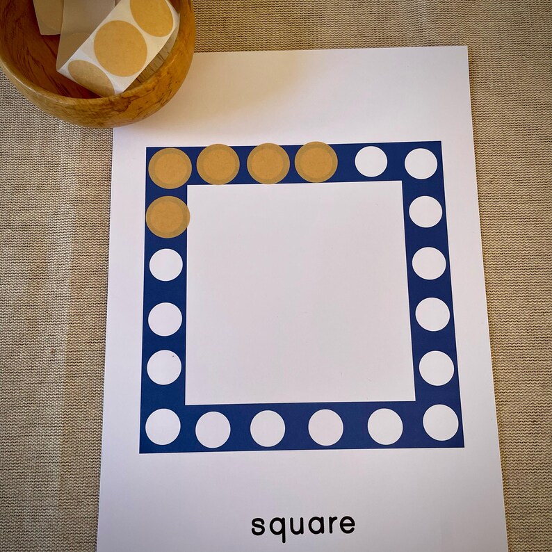 May include: A white sheet of paper with a blue border of white circles. The border is outlined in blue. The top row of the border has brown circles instead of white. The word "square" is printed at the bottom of the page.