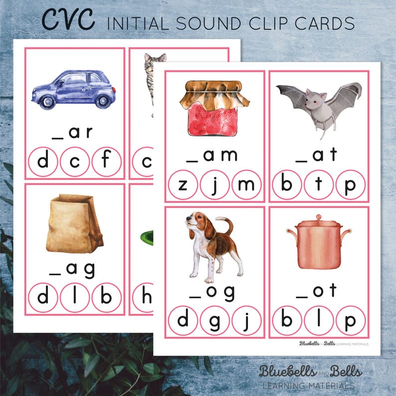 May include: A set of CVC initial sound clip cards featuring colorful illustrations of a car, cat, jam jar, bat, bag, dog, and pot. Each card has a picture and a word with a blank space for the initial sound letter. The letters are printed in circles with pink outlines.