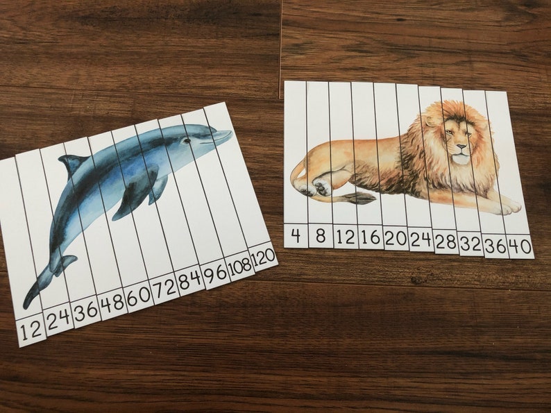 May include: Two printable educational activity sheets for kids. One sheet features a blue dolphin with numbers 12 to 120 printed below. The other sheet features a brown lion with numbers 4 to 40 printed below.