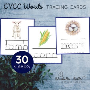 May include: 30 tracing cards featuring watercolour illustrations of a lamb, corn, and a nest with eggs. Each card has a dotted line for tracing the CVC words "lamb", "corn", and "nest".