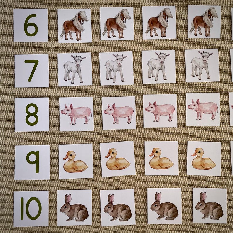 May include: A set of 10 cards with numbers 6 through 10 and corresponding images of animals. The animals include ponies, goats, pigs, ducks, and rabbits. The cards are white with green numbers and are arranged in a grid.