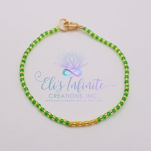 Ilde de Orula y Ochun con Cuentas Pequeñas 2mm Brillosas - Elastico / Ide of Orula & Ochun with Small 2mm Shiny Seed Beads - Elastic Thread