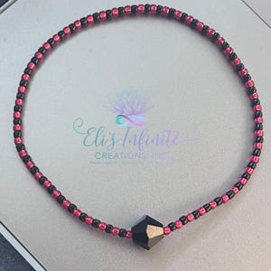 Ilde / Bracelet of Eleggua with Small (2mm) Solid Black & Shiny Red Seed Beads with a Black Bicone Czech Crystal Bead With a Tie Closure