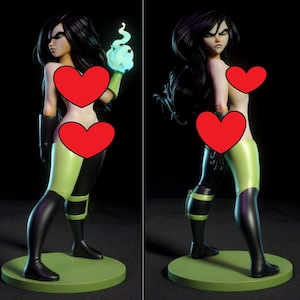 Op de afbeelding: Een beeldje van een vrouw met lang zwart haar, groene ogen en een strenge uitdrukking. Ze draagt een groen en zwart outfit en houdt een gloeiende blauwe vlam vast. Het beeldje staat op een groene cirkelvormige basis.