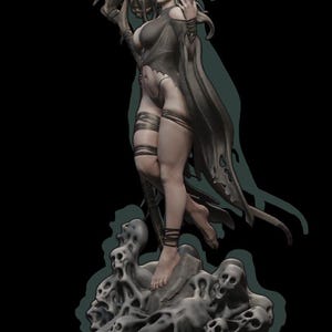 May include: A dark-haired woman in a black dress and cloak stands on a base of skulls. She holds a skeletal scythe in her right hand and a skull in her left hand. The woman has a crown of antlers on her head.