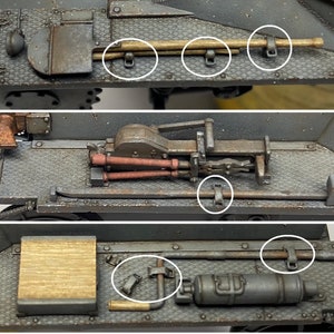Puede incluir: Primer plano de un tanque modelo con varias herramientas y equipos unidos al lateral. Las herramientas incluyen una pala, una varilla de metal y un extintor. El tanque est&aacute; pintado de color gris oscuro.