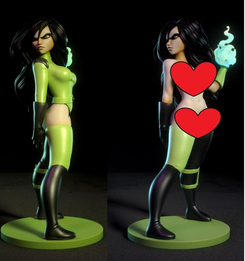 Op de afbeelding: Een groen en zwart beeldje van een vrouwelijk personage met lang zwart haar. De figuur draagt een groen bodysuit met zwarte accenten en laarzen. De figuur staat op een groene cirkelvormige basis. Het personage houdt een gloeiende blauwe bol vast.