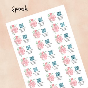 May include: A sheet of stickers with a floral design and a QR code. The text on the stickers reads "Escane el código para visitar JW.ORG".