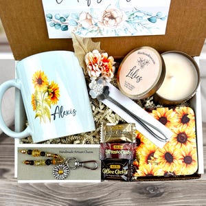 sunflower gift basket with personalized mug, scented candle, handmade artisan charm, candy, engraved spoon, coaster