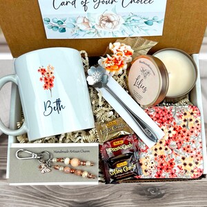 Blush birthday gift basket with personalized mug, scented candle, handmade artisan charm, candy, engraved spoon, coaster