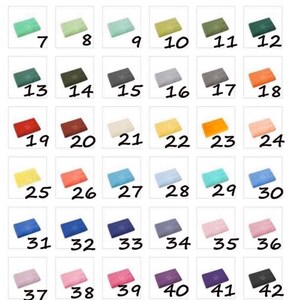 May include: A set of 43 colorful rectangular towels, numbered 1 through 43. The towels are arranged in a grid pattern.